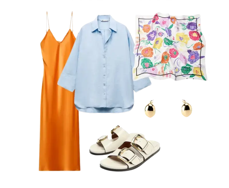 vestido slip dress longo em cetim laranja, camisa oversized azul clara em linho, echarpe estampada floral multicolorida, sandálias slide em couro branco com fivela dourada, brincos dourados