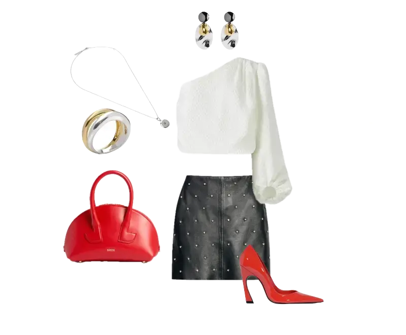 top de um ombro só branco texturizado, saia de couro preta com rebites prateados, scarpins vermelhos verniz, bolsa estruturada vermelha, brincos metálicos dourados e prateados, colar delicado com pingente, anéis volumosos