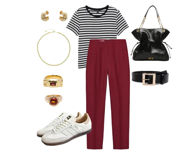 camiseta listrada preta e branca, calça de alfaiataria vinho, tênis branco com detalhes marrons, bolsa preta estruturada, brincos dourados, anéis robustos, cinto preto de fivela
