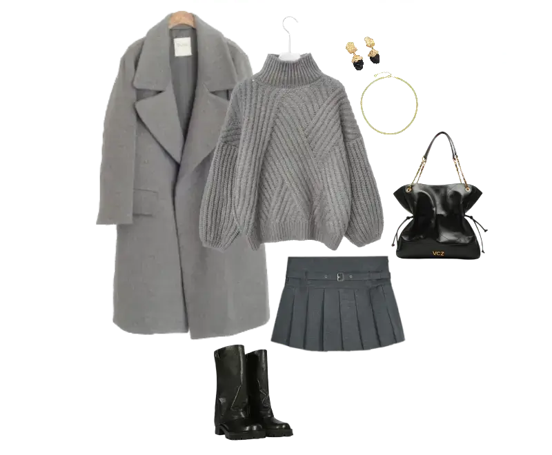 suéter de tricô cinza, saia plissada cinza, casaco longo cinza, botas de couro pretas, brincos dourados, pulseira minimalista, bolsa preta de couro