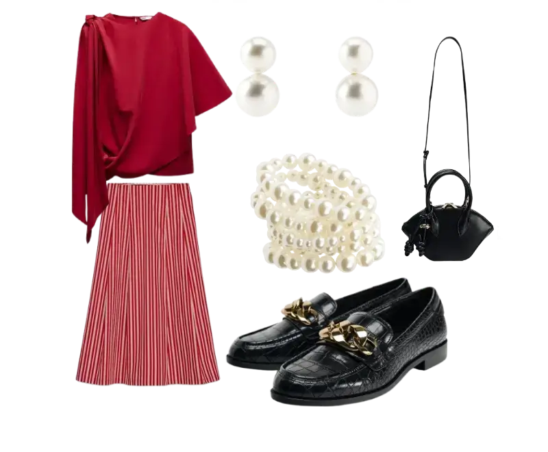 blusa vermelha drapeada, saia midi listrada em rosa e branco, mocassins pretos texturizados com corrente dourada, brincos de pérolas, pulseira de pérolas, bolsa preta de mão compacta e estruturada