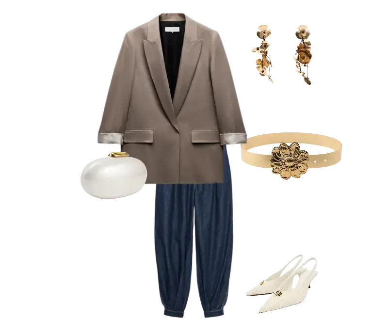 blazer taupe, calça jeans azul de corte solto, sapatos slingback brancos com detalhe dourado, cinto bege com ornamento floral dourado, clutch branca estruturada, brincos dourados em formato floral