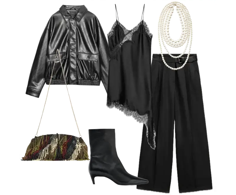 jaqueta bomber em couro preto, top de cetim preto com detalhes em renda, calça de alfaiataria preta de corte amplo e fluido, botas ankle de couro preto com salto baixo, colares de pérolas, bolsa de mão com franjas coloridas