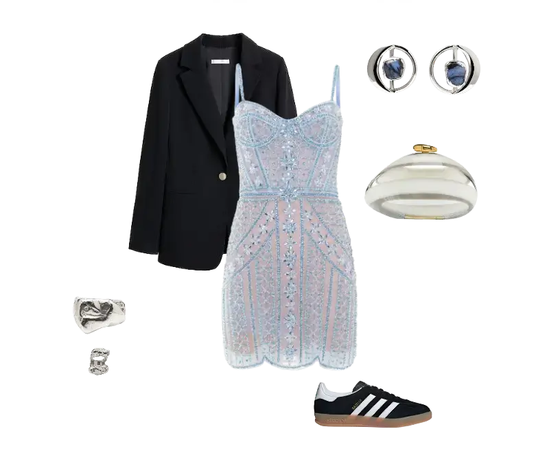 vestido mini azul claro com bordados florais e renda, blazer preto clássico, tênis preto com listras brancas, brincos circulares prateados, anéis minimalistas prateados, clutch prata metalizada
