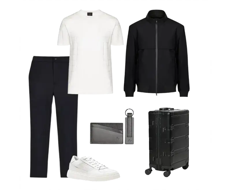 camiseta branca texturizada, casaco preto, calça alfaiataria preta, tênis branco de couro, carteira cinza, chaveiro, mala rígida preta