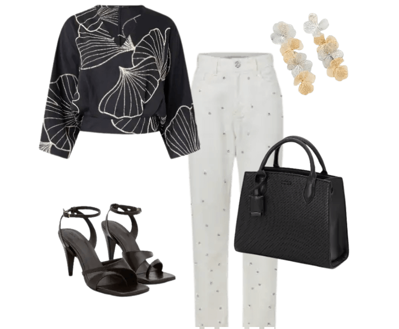 blusa preta estampada, calça branca com detalhes, sandálias pretas de salto, bolsa preta texturizada, brincos florais dourados e prateados.