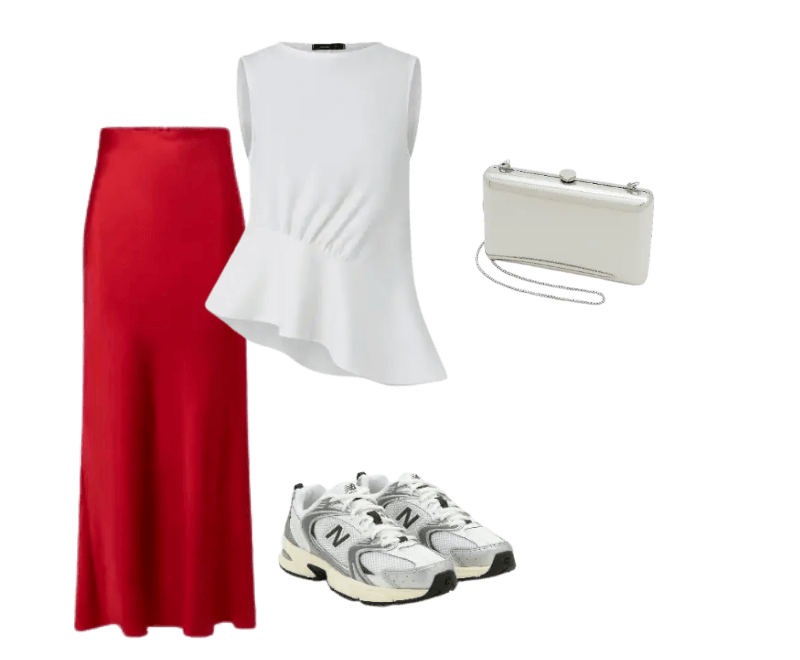 blusa branca sem mangas, saia longa vermelha, tênis cinza, bolsa de mão branca.