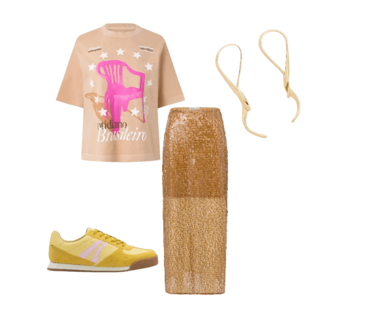 camiseta nude gráfica, saia dourada longa, tênis amarelo, brincos dourados