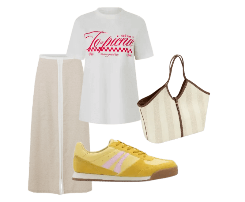 camiseta branca estampada, saia bege de linho, tênis amarelo, bolsa tote listrada bege e marrom.