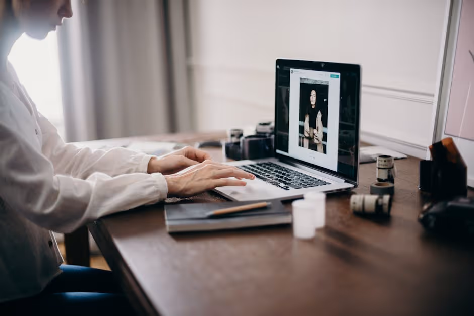 person applying for a loan on a laptop from their home office - quick turnaround loans