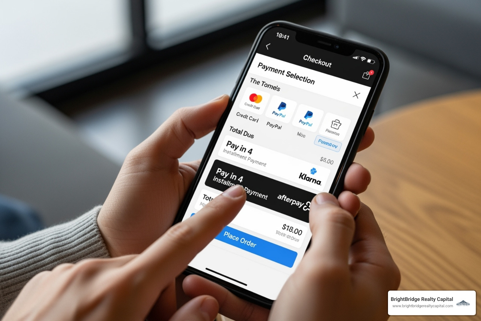 person using a smartphone to complete a purchase with a Pay in 4 option at an online checkout - Flexible financing options person using a smartphone to complete a purchase with a Pay in 4 option at an online checkout - Flexible financing options