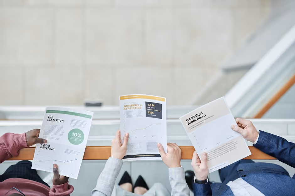 An investor meeting with a loan officer, reviewing documents. - property acquisition loan