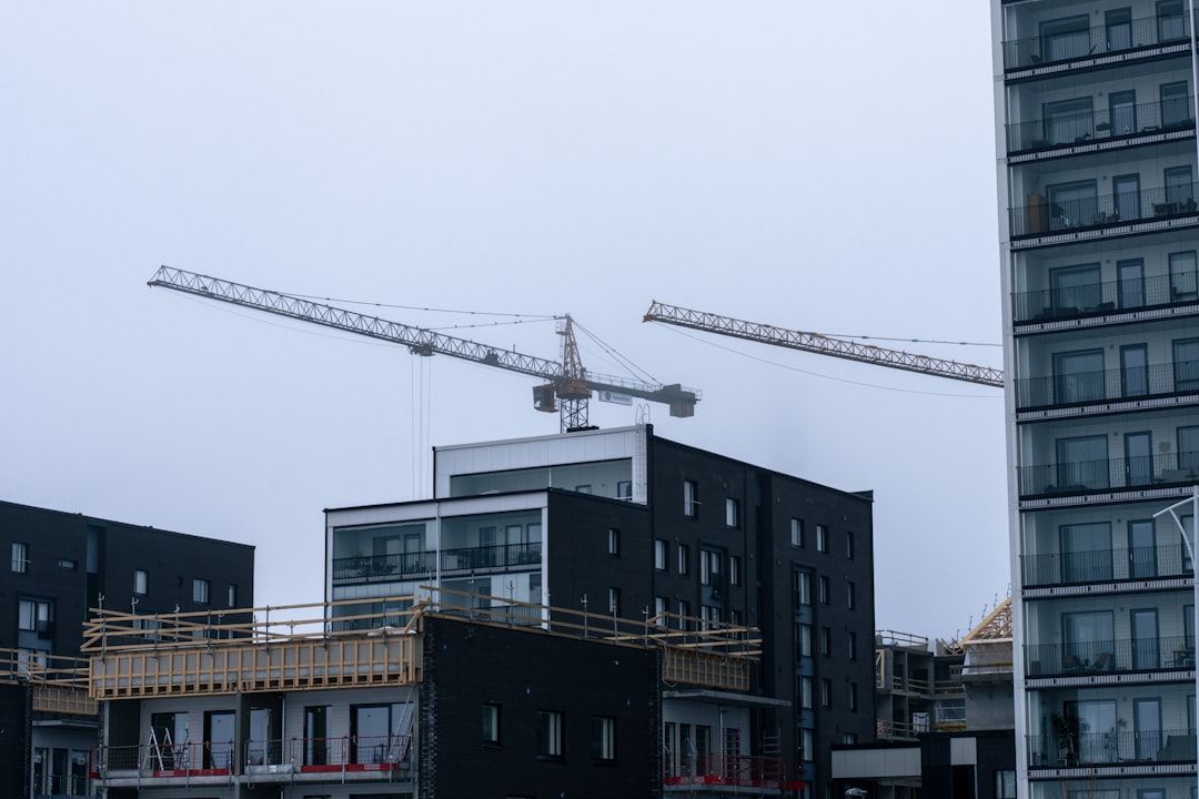 Construction site with cranes and scaffolding - ground up development loans