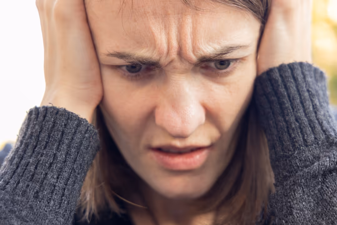 frustrated person looking at mortgage paperwork - short term rental loan