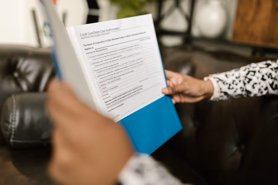 a person reviewing a loan application document - bridge loan when buying a home