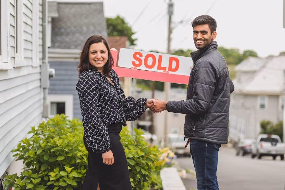 Handshake closing a real estate deal - Real estate debt
