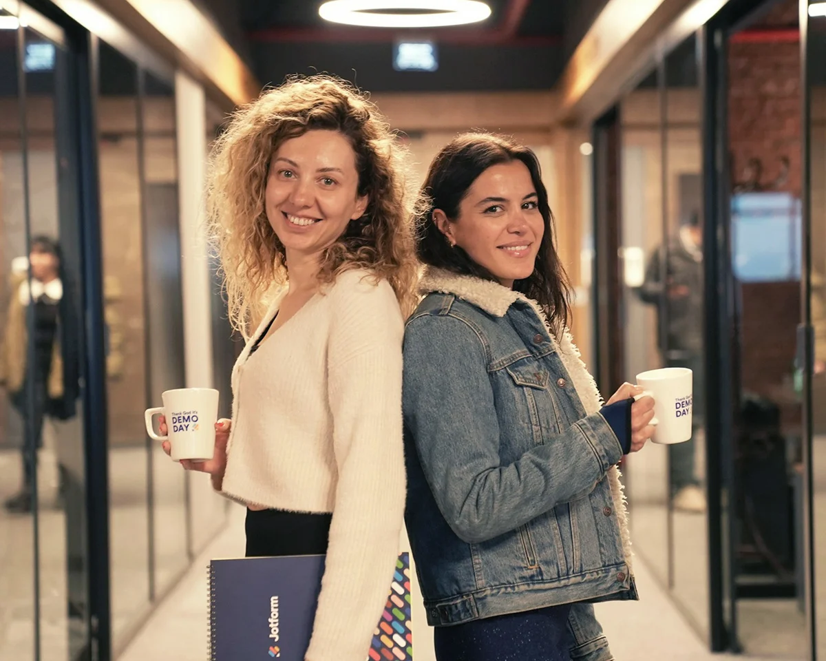 2 women in corporate setting