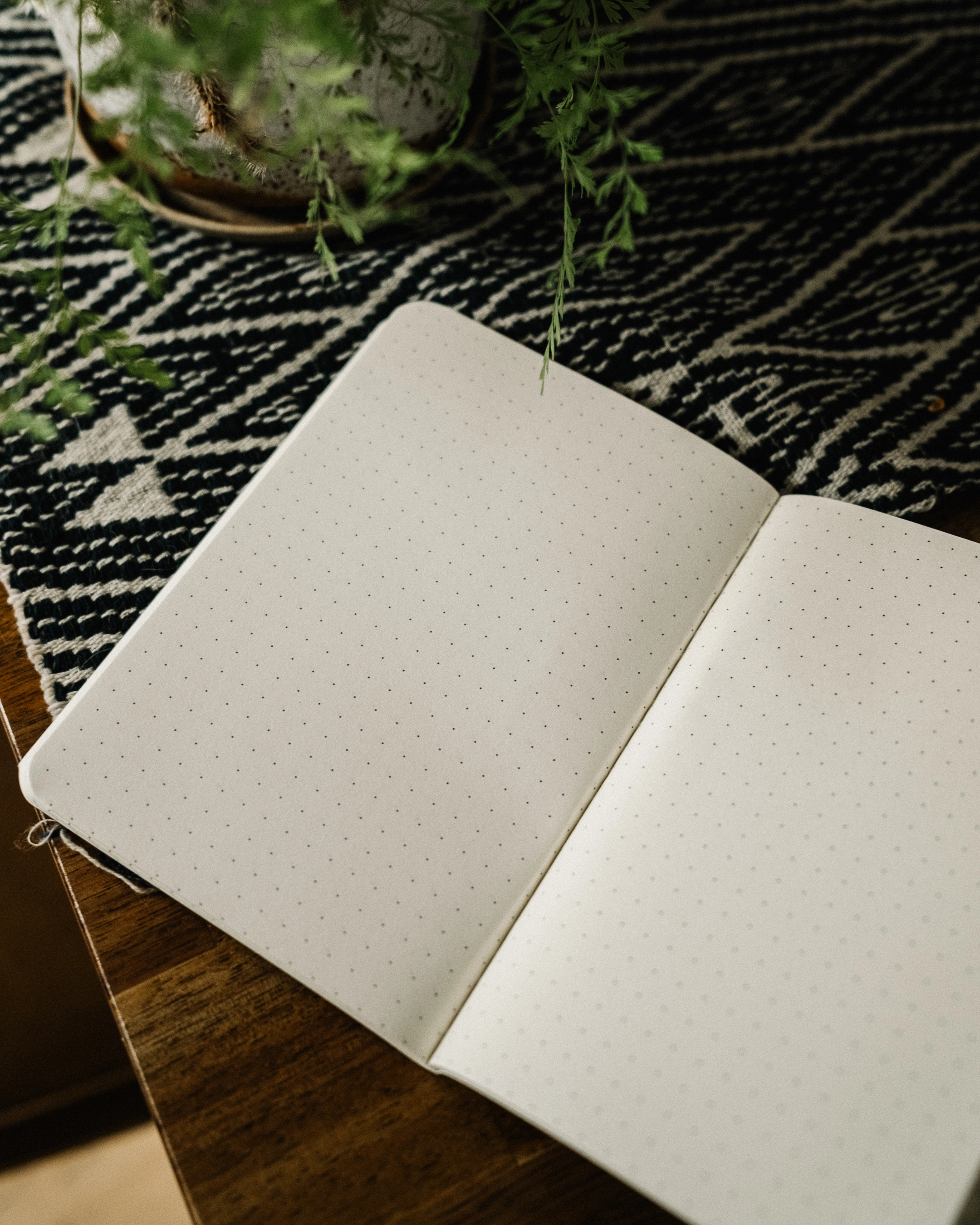 Dotted pages of the SUIKA Passport Notebook, open flat