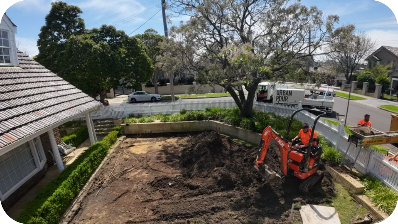 A large, orange Urban Pumping concrete boom pump truck, with text overlaid that reads "Boom Pump" and "Hard-to-Reach Projects."