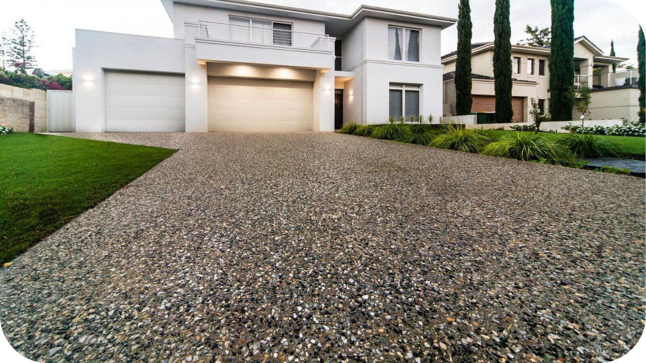 Contemporary Melbourne home with an exposed aggregate concrete driveway and landscaped garden, showing durable residential concreting finishes that enhance curb appeal.