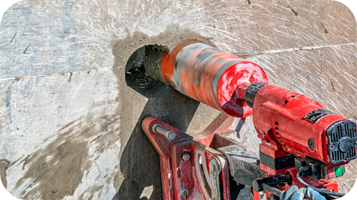 High-speed concrete core drilling machine cutting a clean circular opening in a concrete wall with controlled dust and precise professional drilling results.