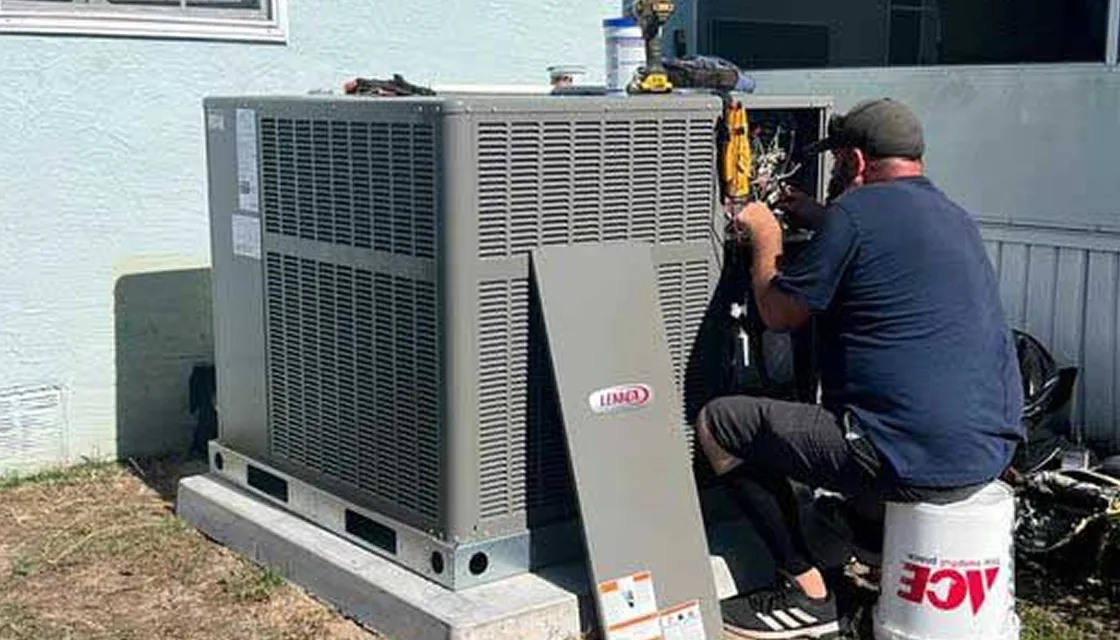 FL HVAC Services technician servicing a Lennox AC unit at a Florida home