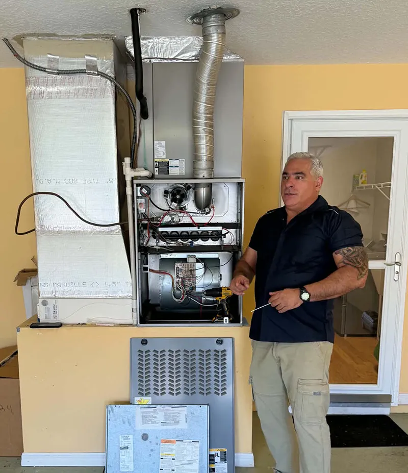 FL HVAC Services technician taking a mold sample from an AC air handler
