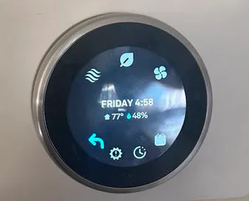 Thermostat in a Florida home showing comfortable temperature and humidity