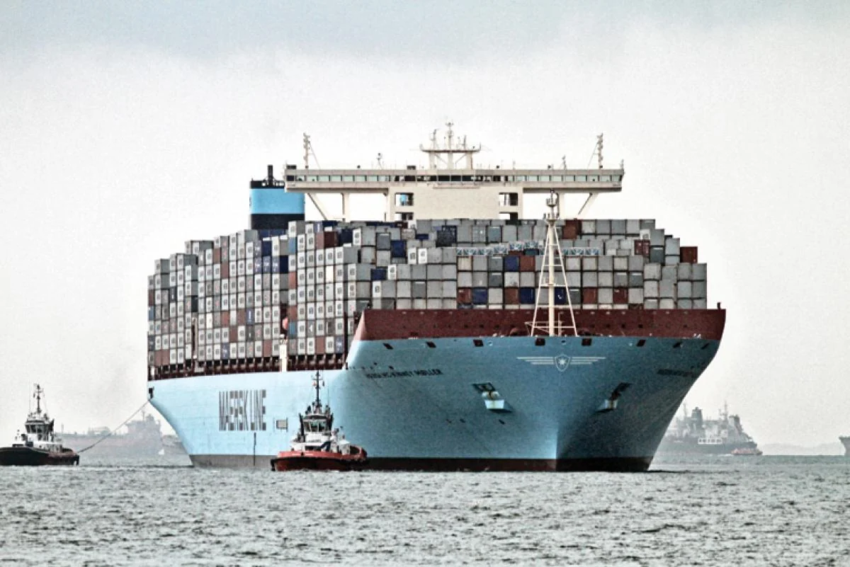 Large container ship floating on open water, proof that heavy engineering problems are solved with known science