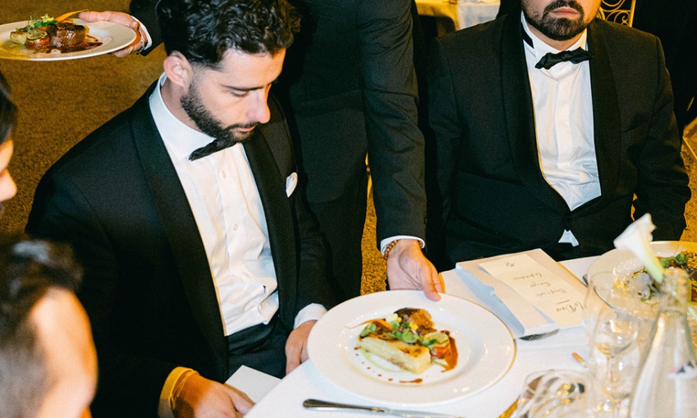 Guest receiving a tailored wedding dish, seamless dietary restriction handling by DV Traiteur premium catering