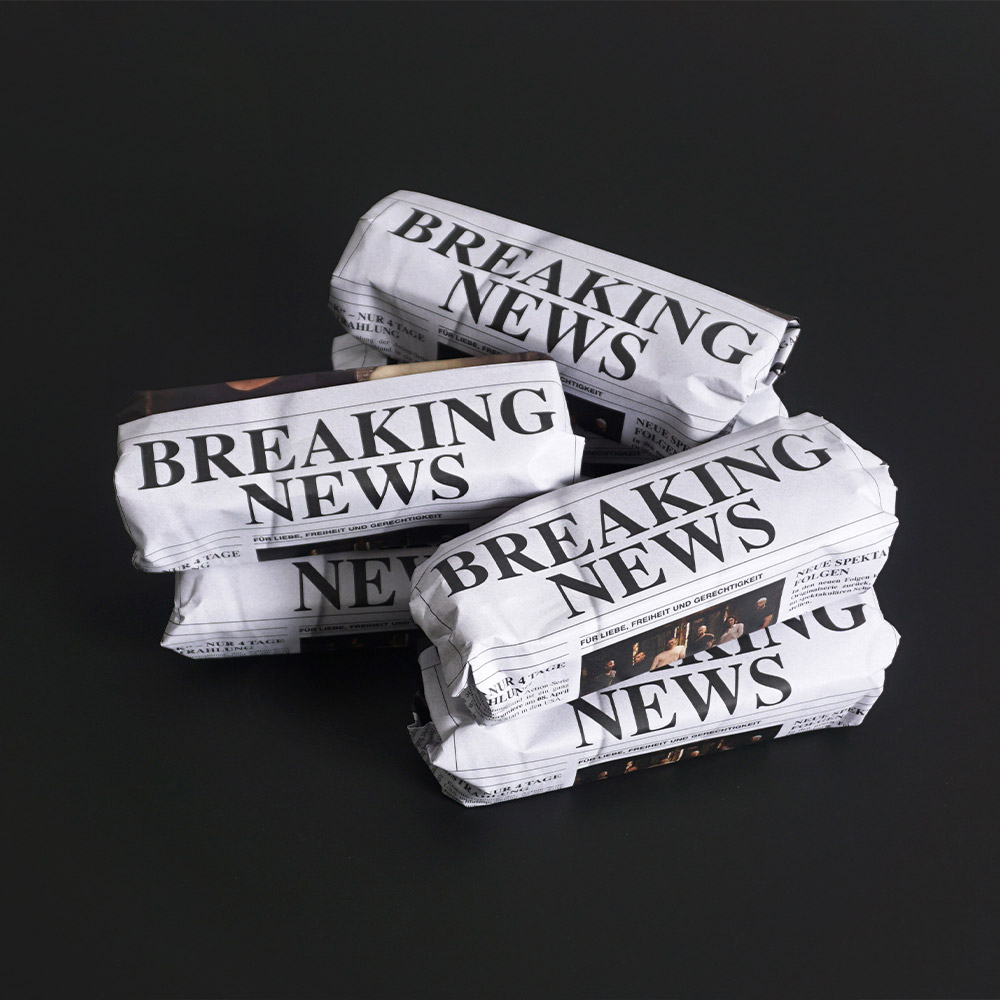 Päckchen im Zeitungslook mit „Breaking News“ für RTL II – Bezug zur Serie Prison Break.