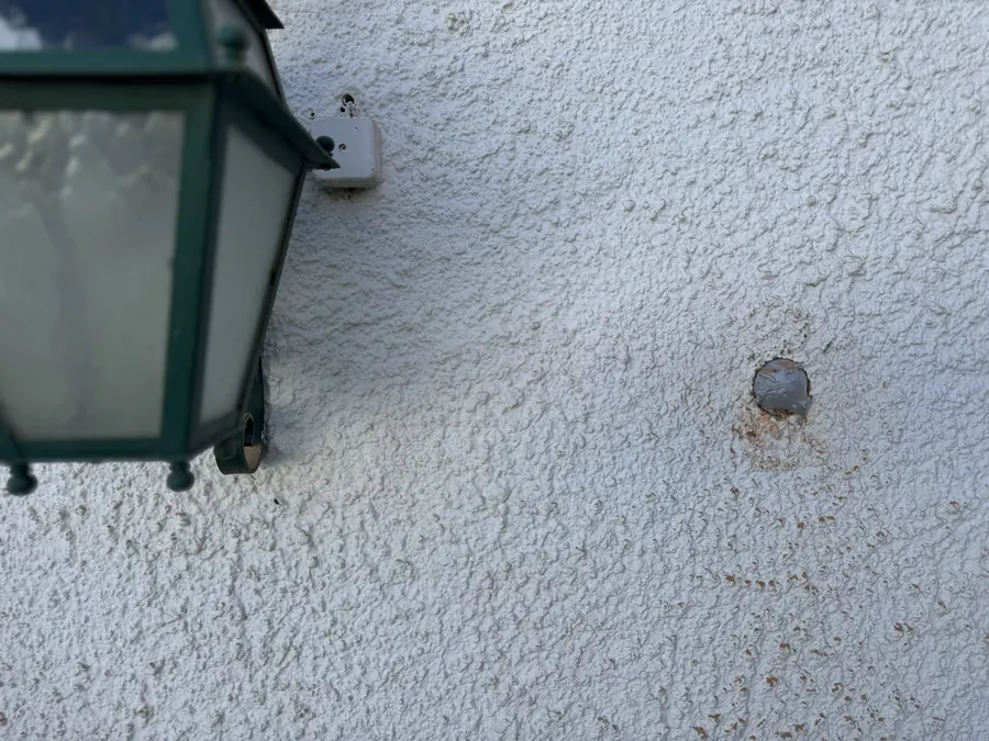 Closed hole in the façade, ready to paint