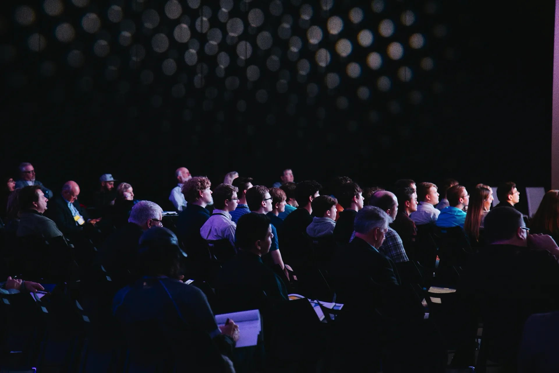 An image of people sitting in an auditorium