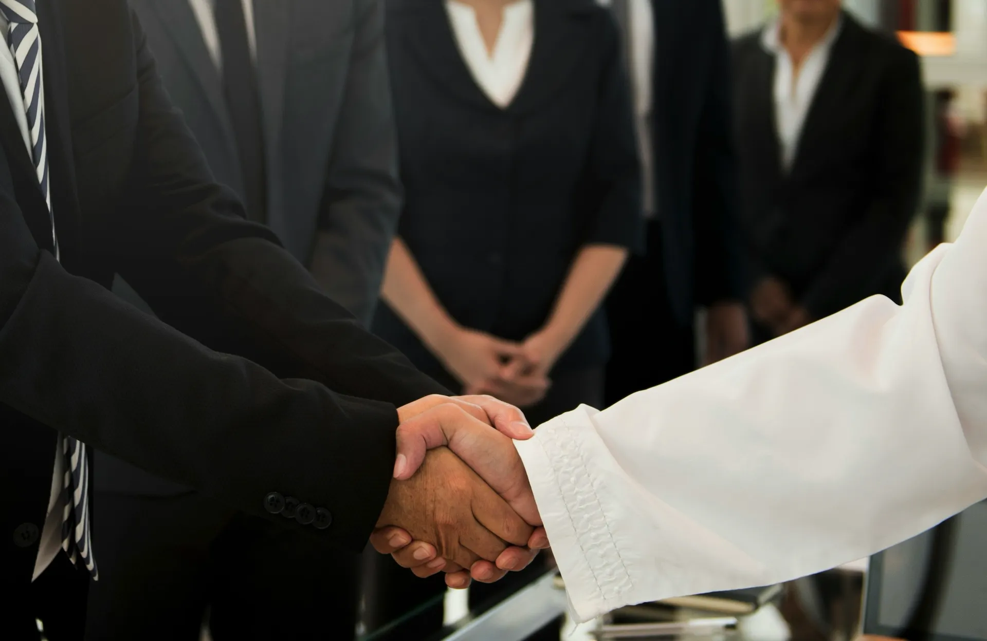 A photo of people shaking hands
