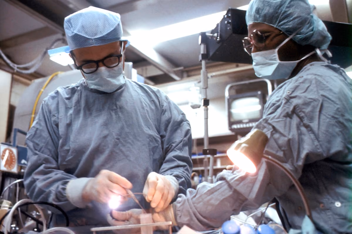 Surgeon performing advanced robotic minimally invasive surgery in modern operating room