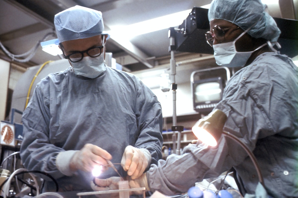 Surgeon performing advanced robotic minimally invasive surgery in modern operating room