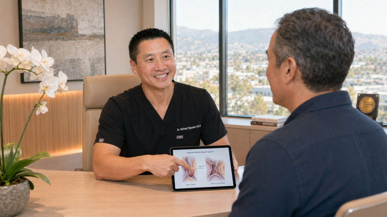 Dr. Richard Nguyen consulting with patient about inguinal hernia surgery in San Jose