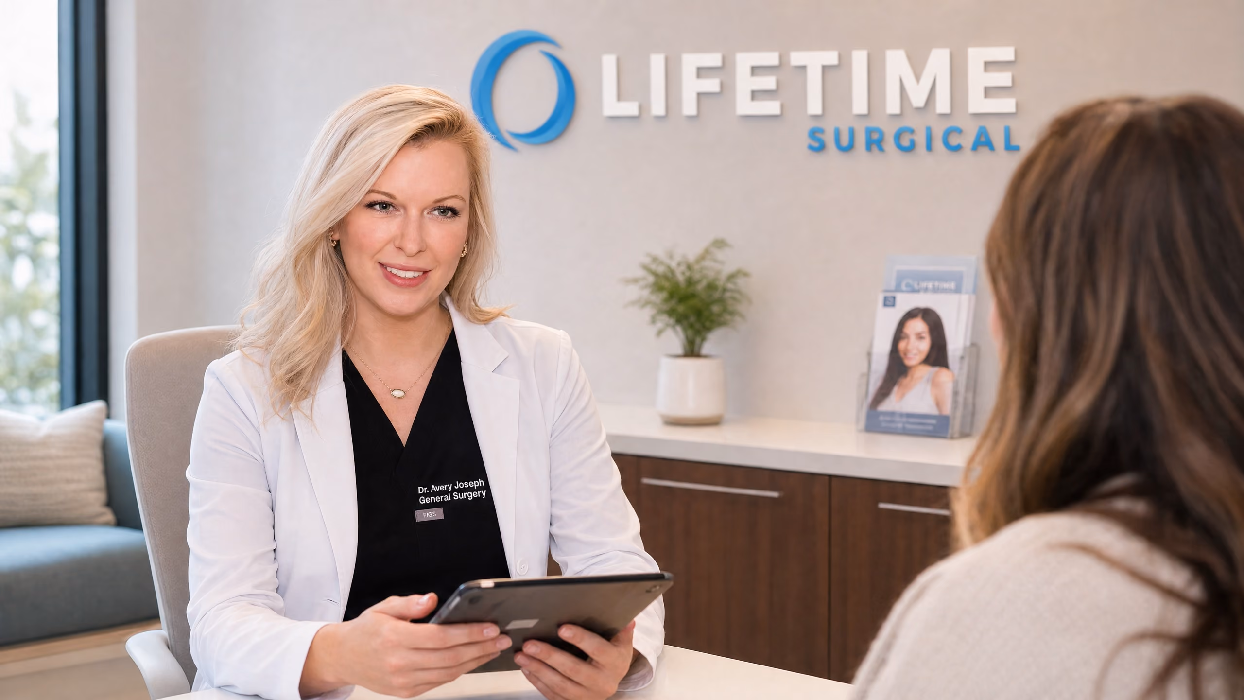 Dr. Avery Joseph consulting with patient at Lifetime Surgical