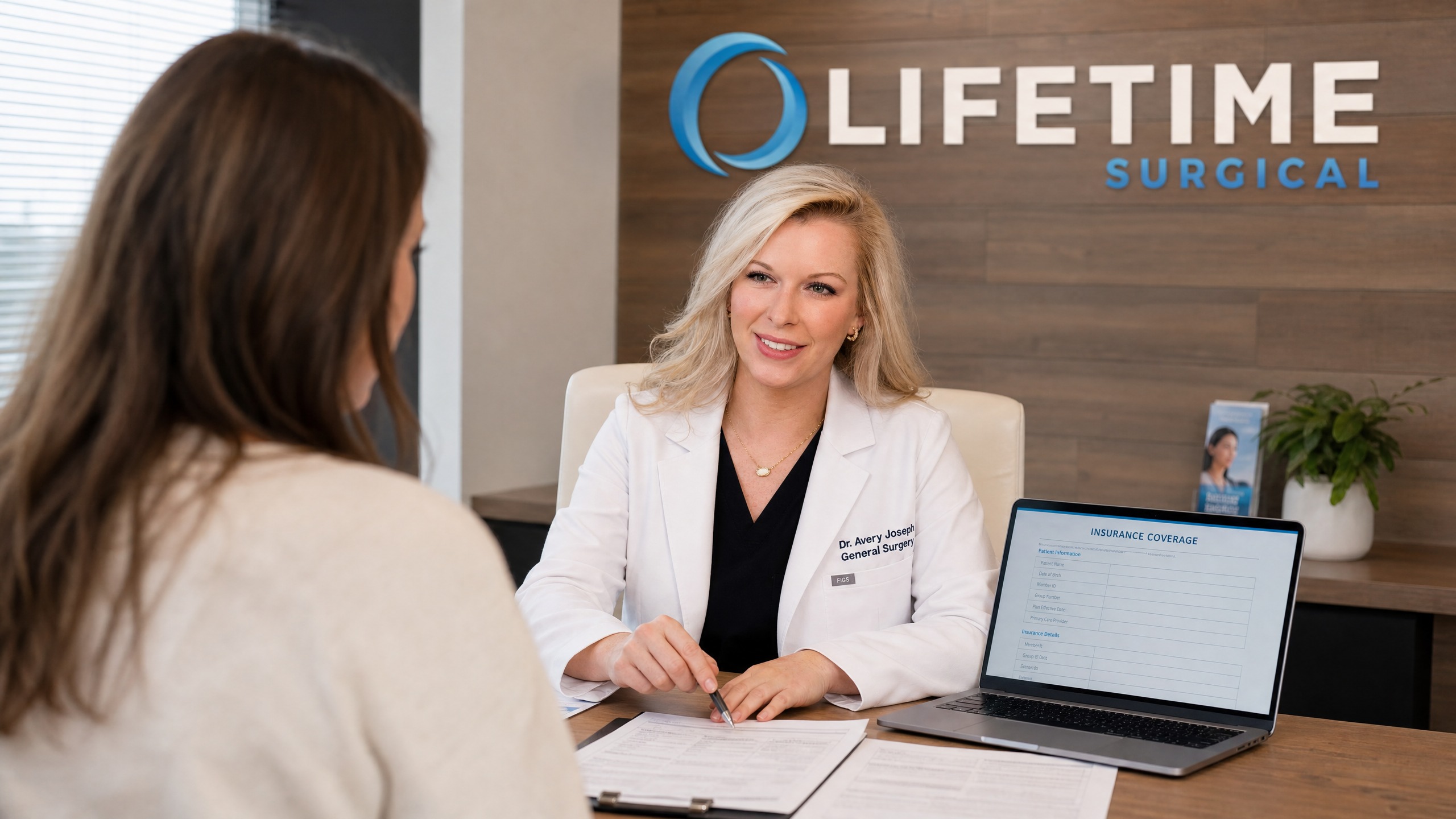 Dr. Avery Joseph reviewing insurance coverage with patient at Lifetime Surgical