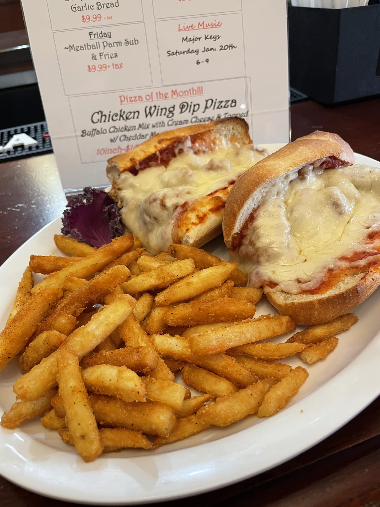 A plate of food with a sandwich and fries.