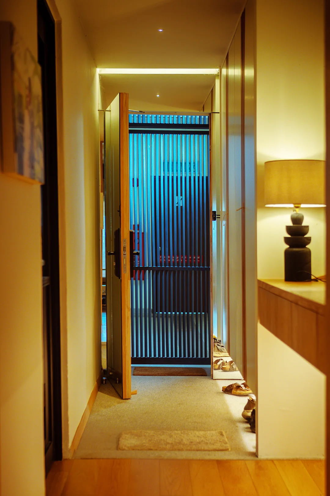 Minimalist apartment entryway with custom EDC storage area.