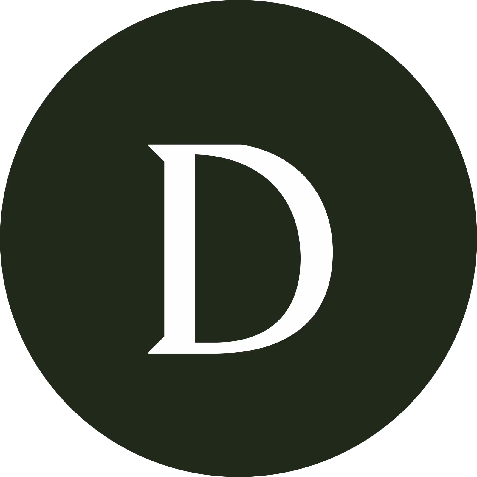 A smiling man and woman pose closely together for a selfie. The man has short curly hair, a beard, and a nose ring, while the woman has long curly hair and is wearing hoop earrings. They are sitting in front of a tiled wall with potted plants in the background. The image is black and white and cropped into a circular frame.