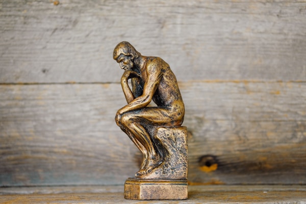 Statue of man thinking