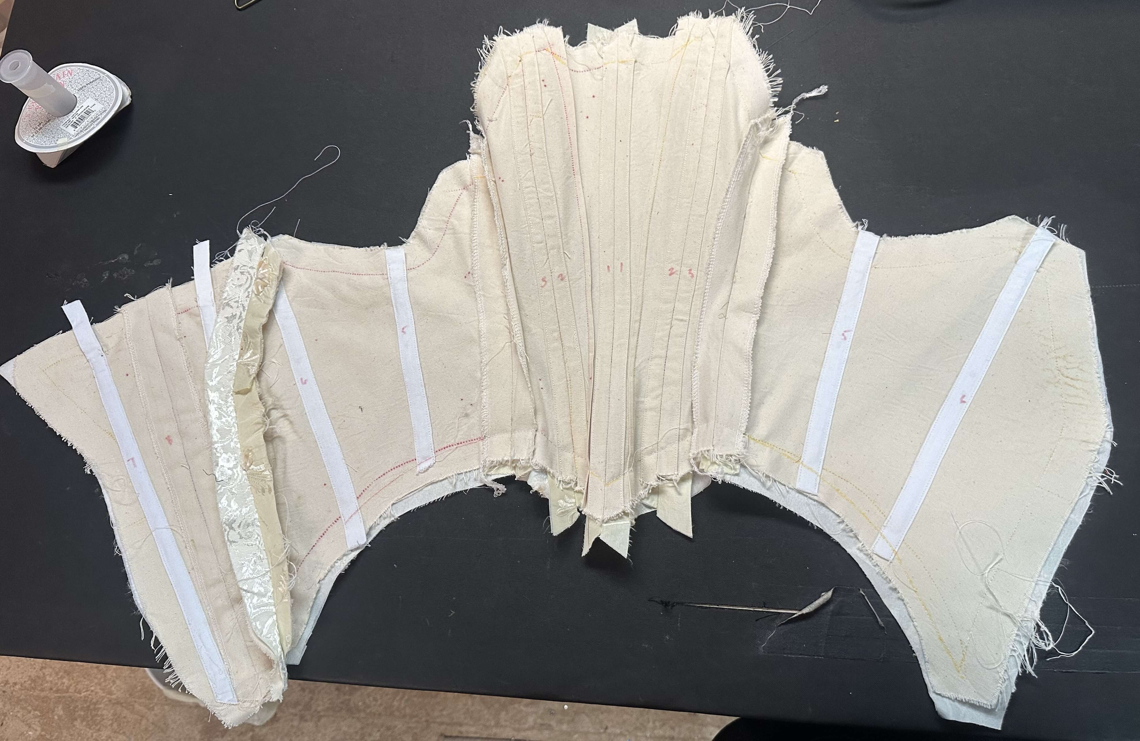 Inside of Dawn wedding dress bodice showing boning channels and cotille layer
