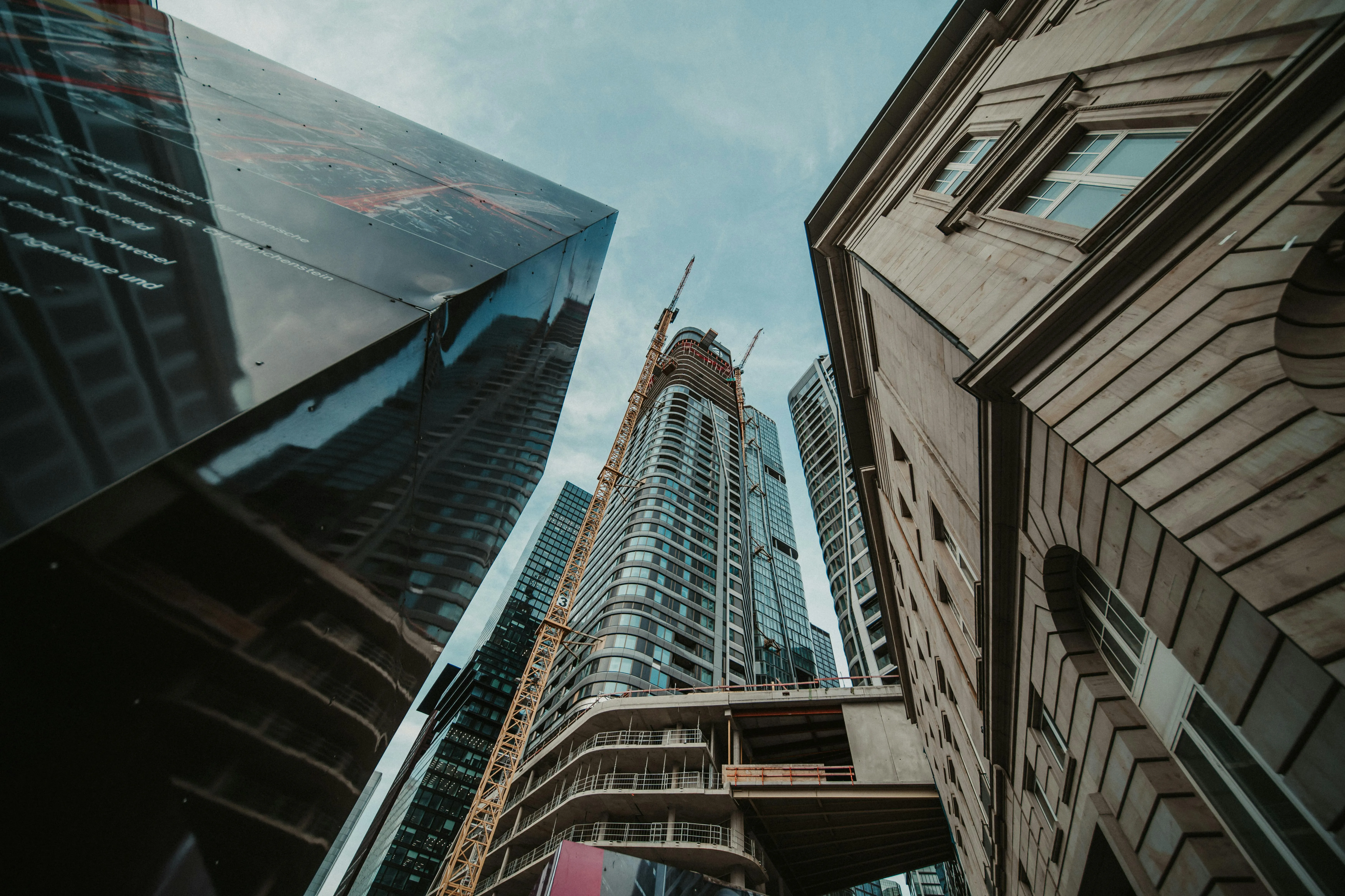 Looking up at a building under construction in the city.