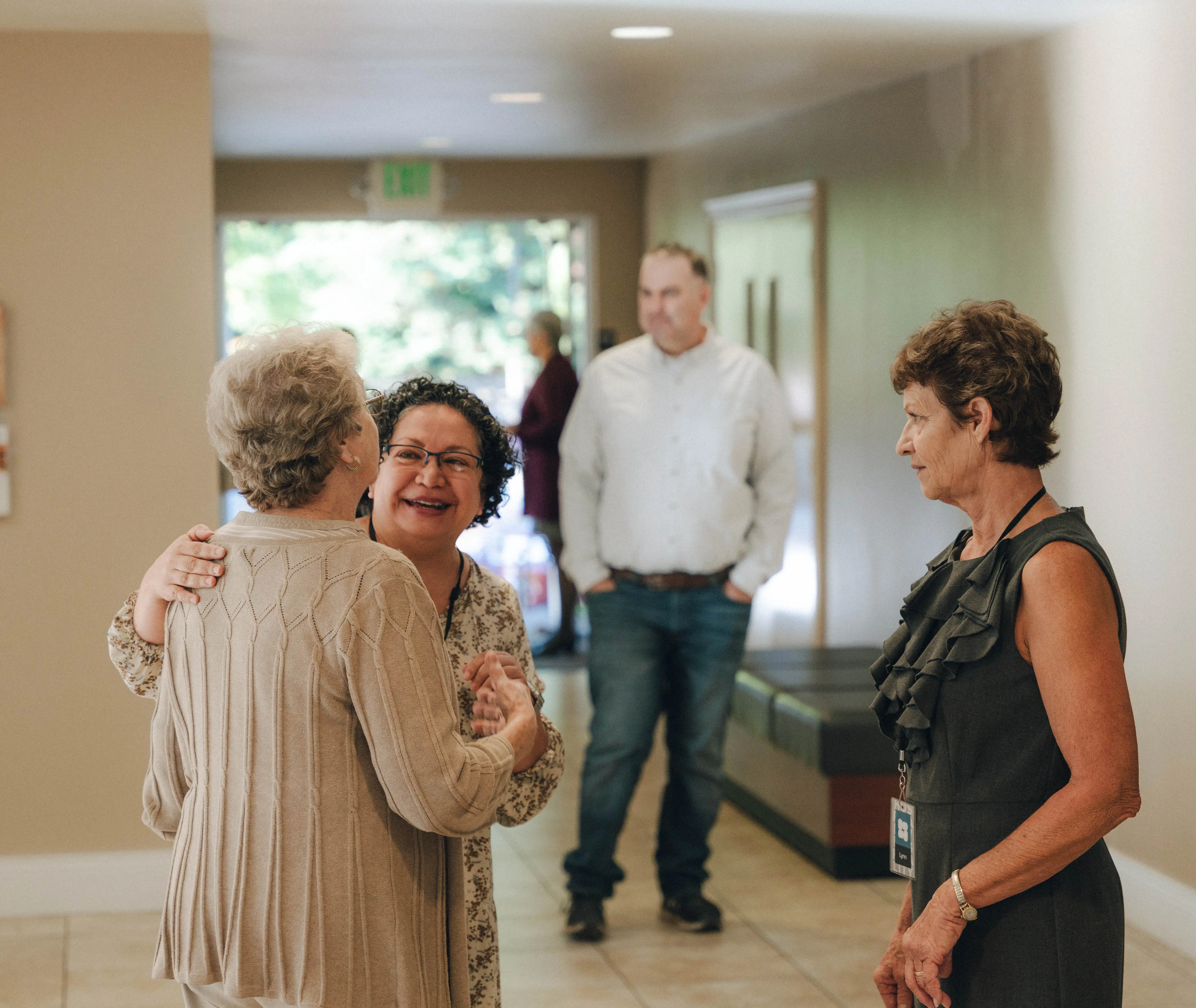 Members of Evangelical Free Church of Chico greeting one another in the church lobby before the Sunday gathering, highlighting community, connection, and hospitality.