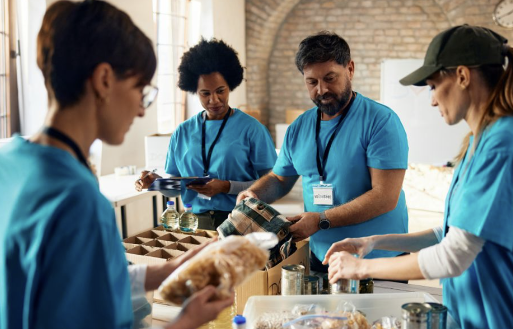 Nonprofit volunteers packing food donations