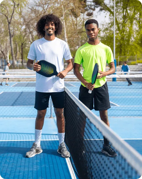 Two pickleball players at the net