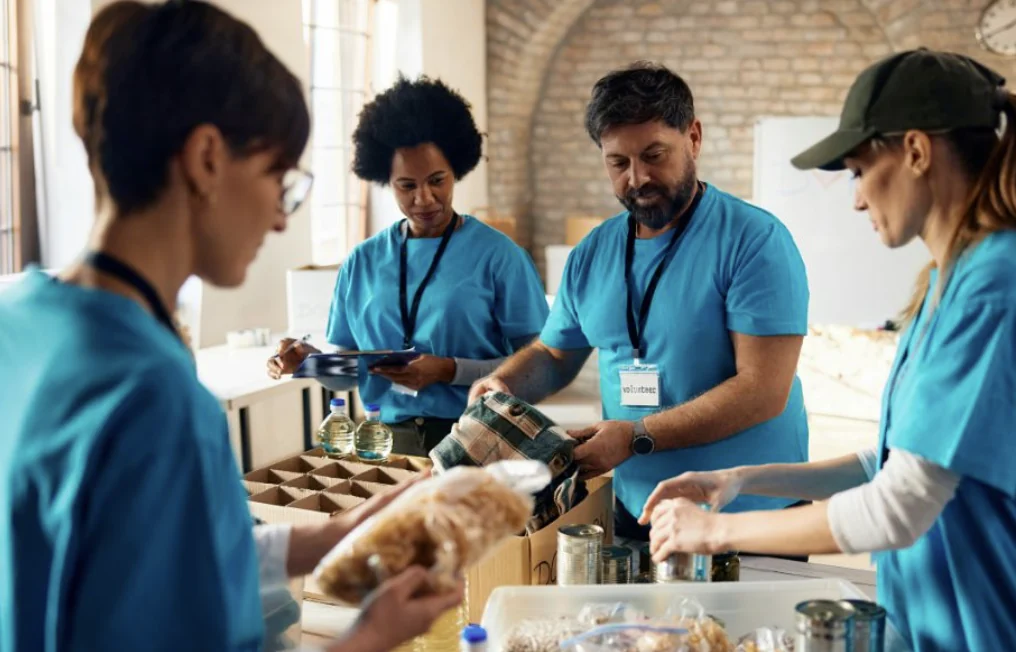 Nonprofit volunteers packing food donations