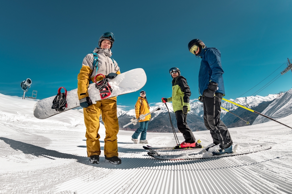 Group of skiers and snowboarders on the mountain